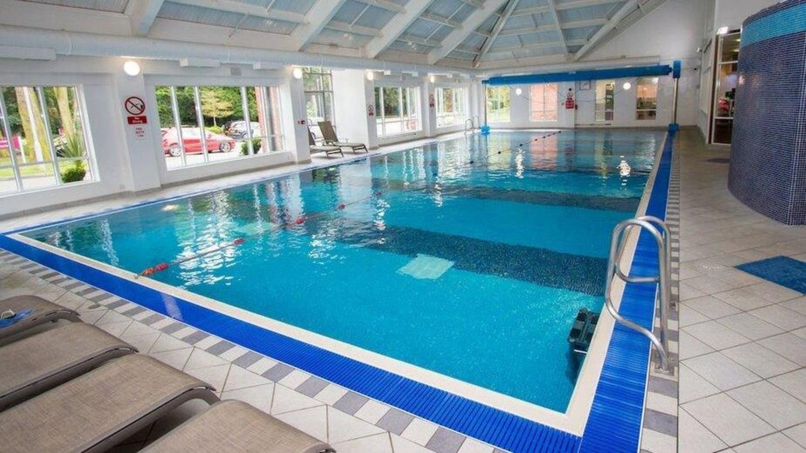 The indoor swimming pool under a glazed roof