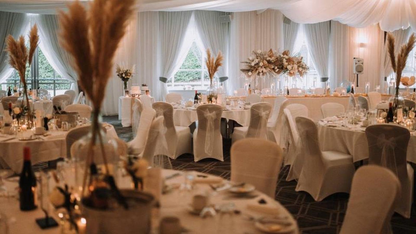 Round tables with pampas grass centrepieces