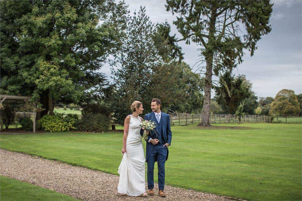 Romantic wedding photo showcasing bride and groom in outdoor setting at Brandon Hall Hotel & Spa.