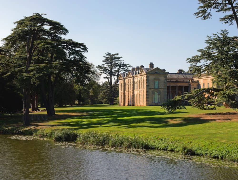 Serene landscape at Brandon Hall Hotel & Spa with historic mansion, expansive gardens, and tranquil water features.